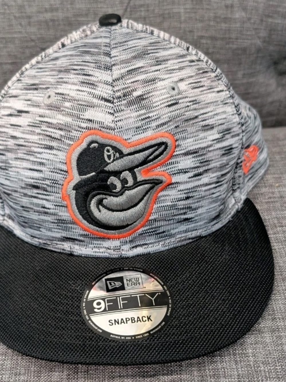 New Era Baltimore Orioles Heather Gray & Black Snapback with Orange Trim
